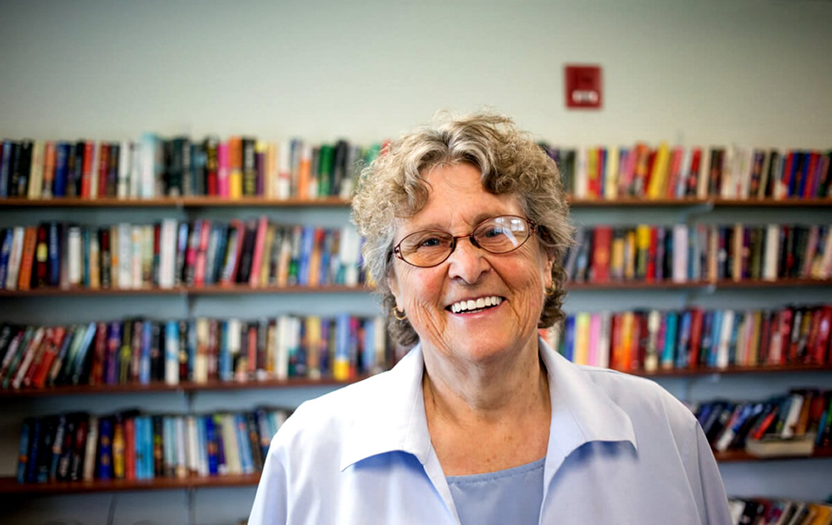 A photo of Ann in the library.