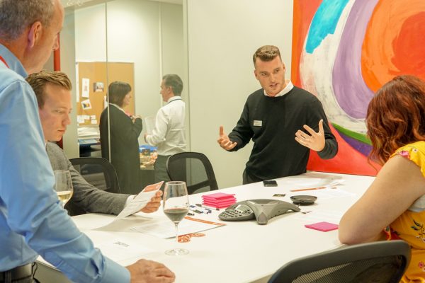 A photo of people working in an office